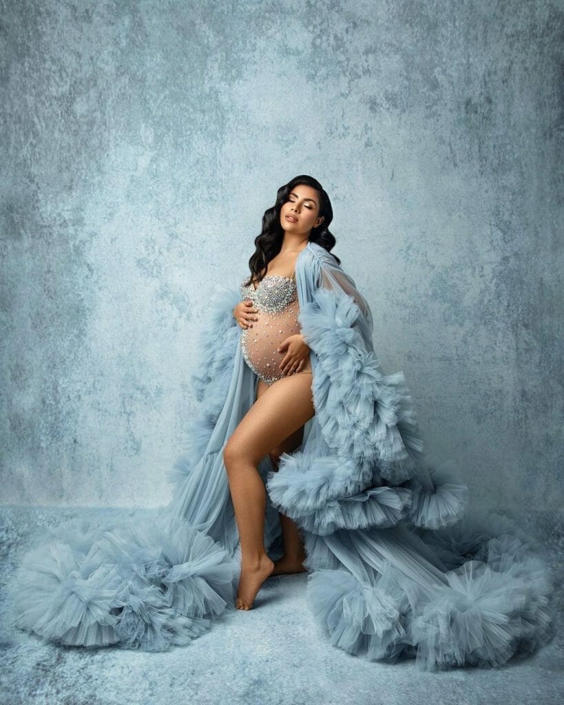 Maternity model with dress and backdrop